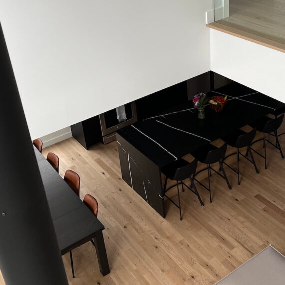 Birds eye view, contemporary kitchen and dining room, La Maison sur la falaise, Biophile architecture