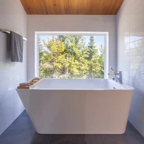 Upstairs bathroom with freestanding bathtub, La Grive project by Biophile architecture